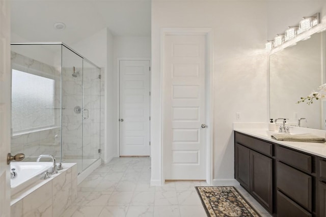 16720 Horondelle Dr, Austin, TX 78738 - bathroom featuring a shower stall, a garden tub, marble look tiles, and vanity