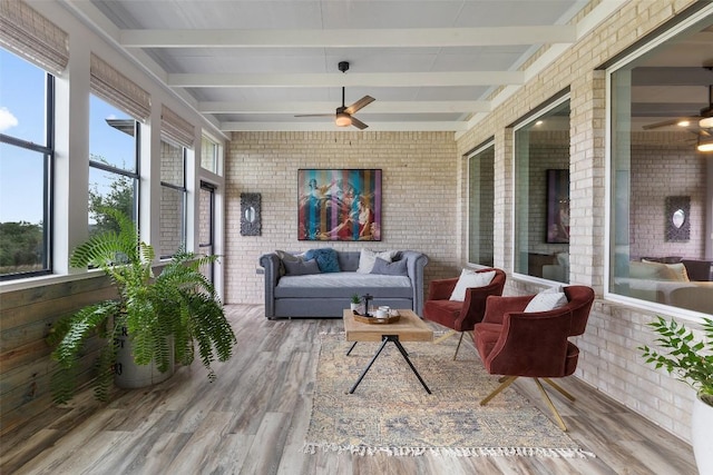 16720 Horondelle Dr, Austin, TX 78738 - sunroom with brick wall, beam ceiling, and wood finished floors