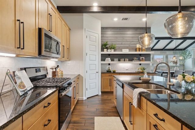 16720 Horondelle Dr, Austin, TX 78738 - kitchen with stainless steel appliances, beam ceiling, dark wood-type flooring, dark stone countertops, and decorative backsplash