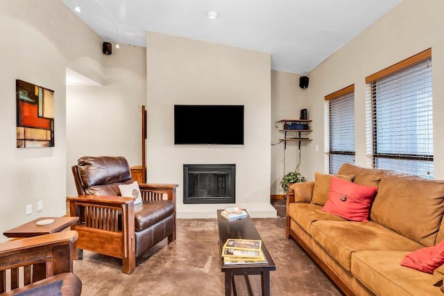living area with a fireplace with raised hearth