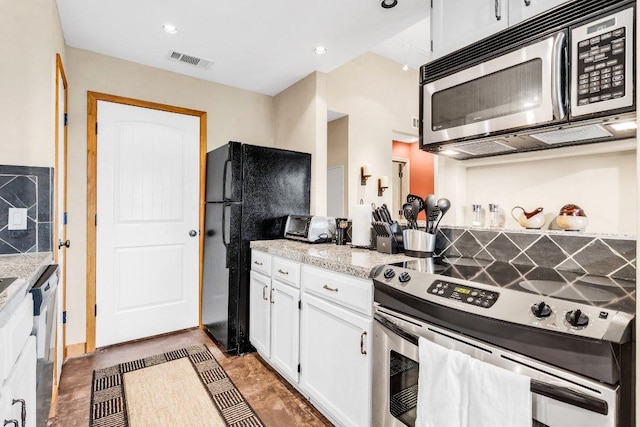 kitchen with visible vents, recessed lighting, white cabinets, and stainless steel appliances
