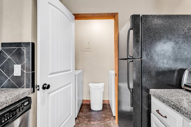 1406 Windsor Rd Unit 305, Austin, TX 78703 - bathroom with washer / clothes dryer, finished concrete floors, and electric panel