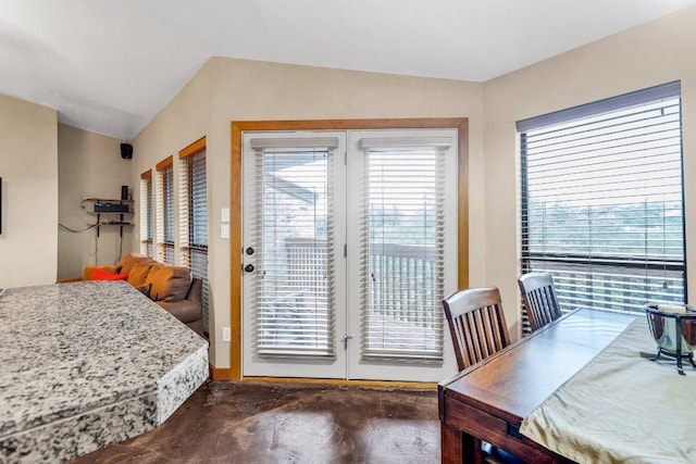 1406 Windsor Rd Unit 305, Austin, TX 78703 - dining space with concrete flooring, plenty of natural light, and vaulted ceiling