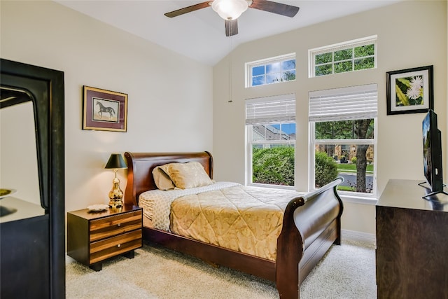 carpeted bedroom featuring baseboards, a ceiling fan, and lofted ceiling