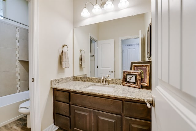 full bathroom featuring toilet and vanity