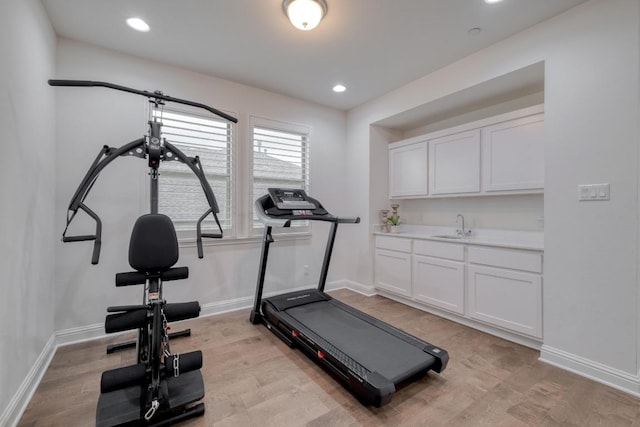 3908 Logan Ridge Dr, Cedar Park, TX 78613 - exercise room with light wood-type flooring, baseboards, a sink, and recessed lighting