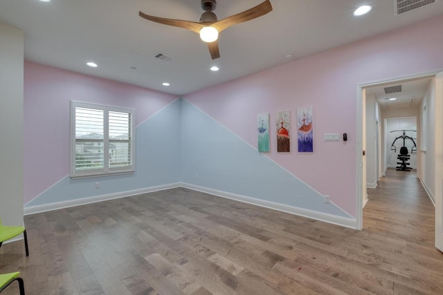 3908 Logan Ridge Dr, Cedar Park, TX 78613 - empty room featuring wood finished floors, a ceiling fan, attic access, baseboards, and recessed lighting