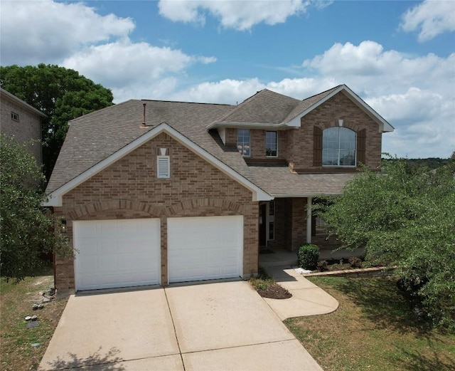 traditional-style house featuring a porch, brick siding, concrete driveway, an attached garage, and a shingled roof