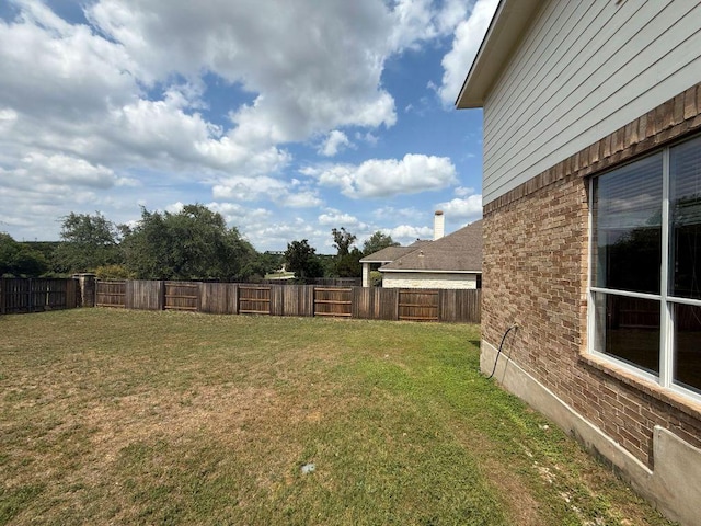 view of yard featuring a fenced backyard