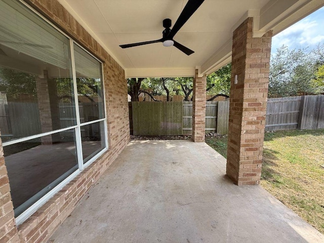 view of patio with a fenced backyard and ceiling fan