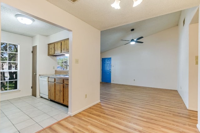 11948 Sunhillow Bnd Unit A & B, Austin, TX 78758 - kitchen with ceiling fan, brown cabinetry, light wood finished floors, and dishwasher