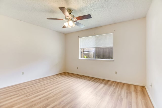 11948 Sunhillow Bnd Unit A & B, Austin, TX 78758 - unfurnished room featuring wood finished floors, a textured ceiling, a ceiling fan, and baseboards