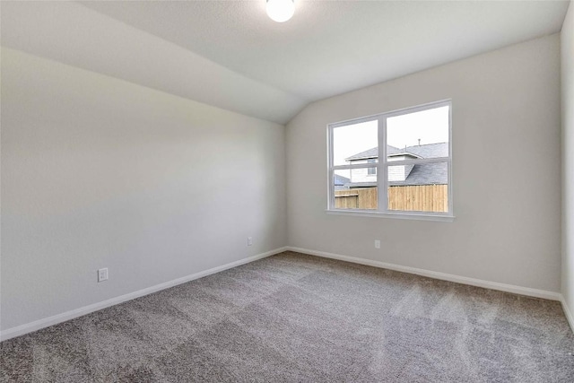 1139 Amy Dr, Kyle, TX 78640 - carpeted empty room featuring baseboards and vaulted ceiling