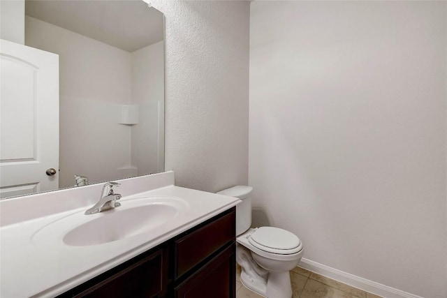 1139 Amy Dr, Kyle, TX 78640 - bathroom featuring toilet, baseboards, tile patterned flooring, and vanity