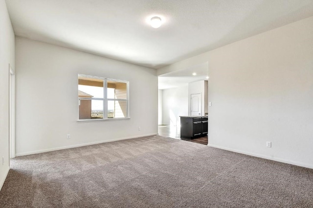 1139 Amy Dr, Kyle, TX 78640 - unfurnished room with dark colored carpet and baseboards