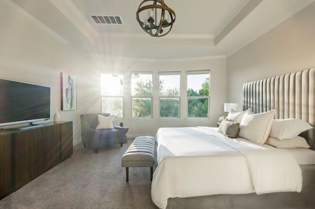 bedroom with visible vents, a raised ceiling, an inviting chandelier, ornamental molding, and carpet