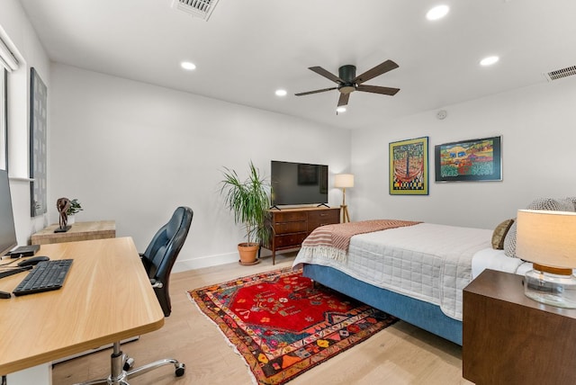 bedroom featuring recessed lighting, wood finished floors, and visible vents