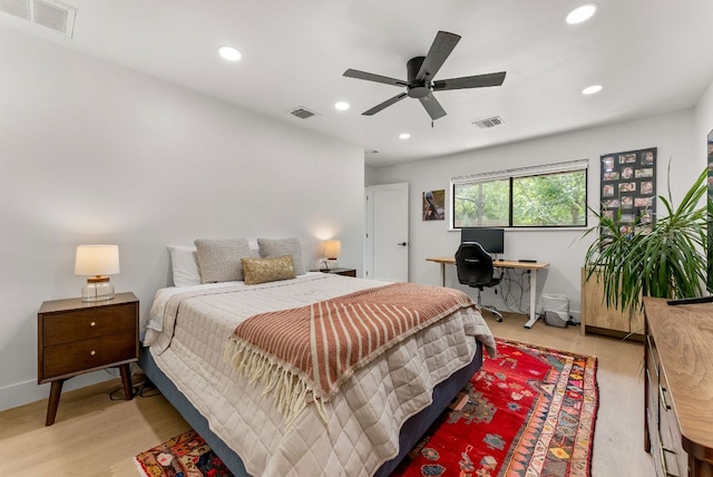 bedroom with light wood-style floors, recessed lighting, and visible vents