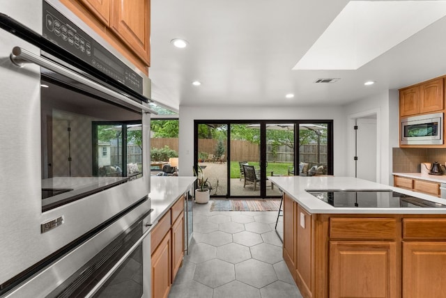 kitchen featuring visible vents, appliances with stainless steel finishes, light countertops, recessed lighting, and light tile patterned flooring