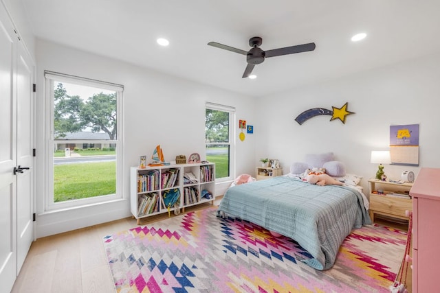 bedroom with recessed lighting, ceiling fan, and wood finished floors