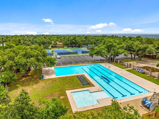 community pool featuring fence