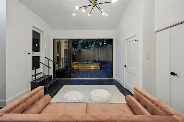 1121 Reagan Ter, Austin, TX 78704 - foyer with lofted ceiling, stairway, a chandelier, and tile patterned floors