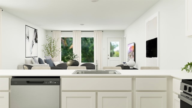 kitchen with a sink, dishwasher, white cabinets, and light countertops
