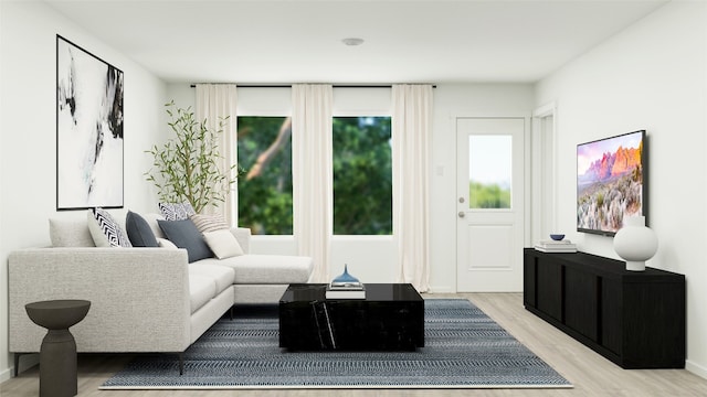 living room featuring baseboards and light wood-style flooring