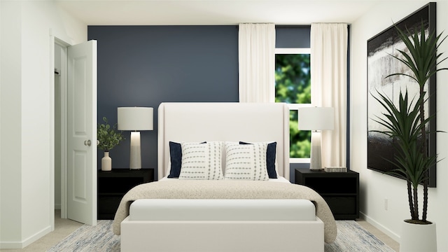 bedroom with baseboards and light carpet