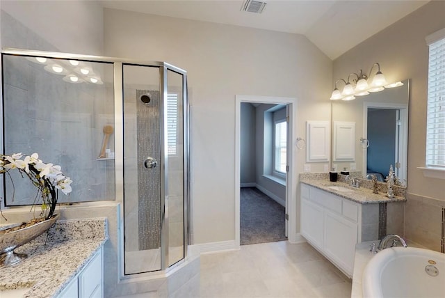 148 Golden Sage Ave, Georgetown, TX 78633 - full bath with a stall shower, a garden tub, lofted ceiling, vanity, and tile patterned flooring