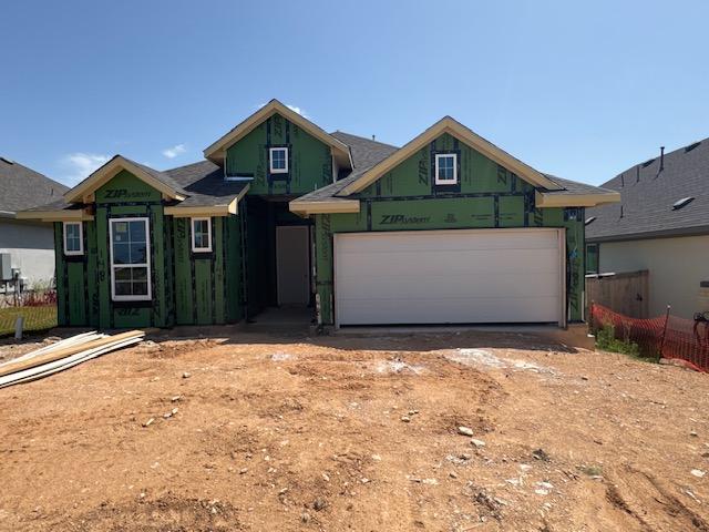148 Golden Sage Ave, Georgetown, TX 78633 - property in mid-construction with dirt driveway and a garage