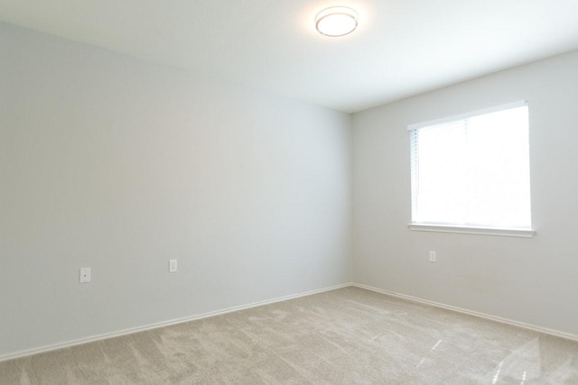 5711 Steven Creek Way, Austin, TX 78721 - unfurnished room with baseboards and light carpet
