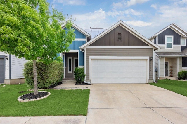 view of front of property with an attached garage, board and batten siding, driveway, and a front yard
