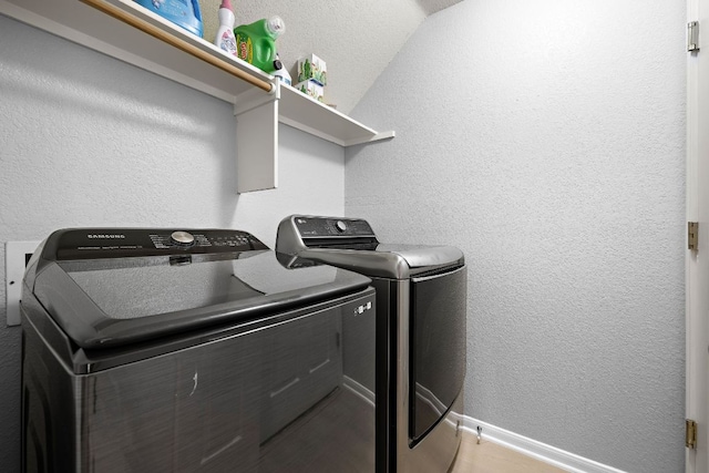 2104 Faldo Ln, Round Rock, TX 78664 - laundry room featuring washer and clothes dryer, a textured wall, and baseboards