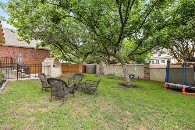 2104 Faldo Ln, Round Rock, TX 78664 - view of yard with a trampoline and a playground