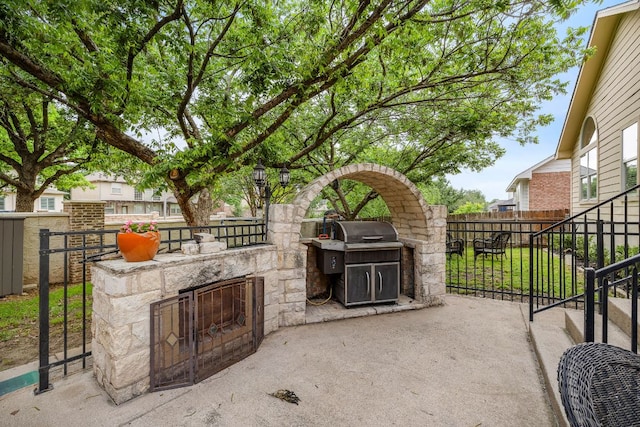 2104 Faldo Ln, Round Rock, TX 78664 - view of patio featuring exterior kitchen