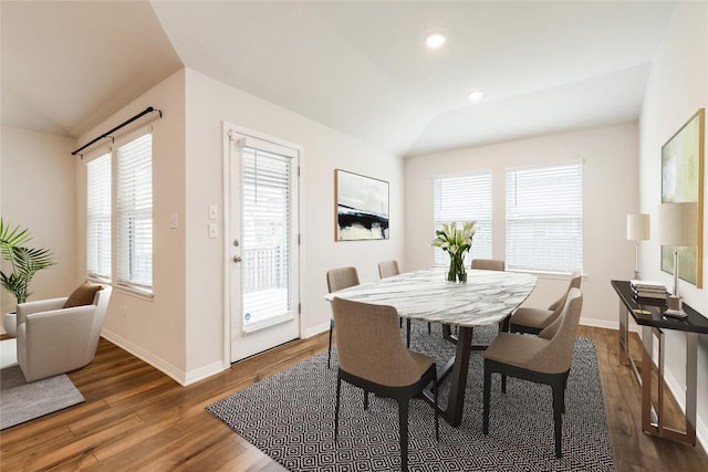 dining space with recessed lighting, baseboards, lofted ceiling, and dark wood-type flooring