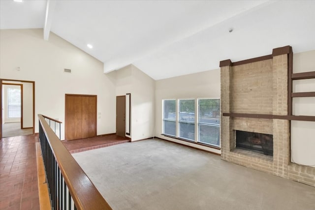2015 Mistywood Dr, Austin, TX 78746 - unfurnished living room featuring beamed ceiling, high vaulted ceiling, and a brick fireplace