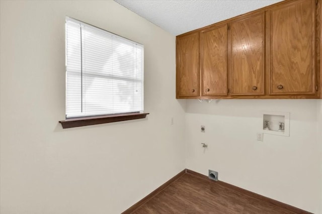 laundry room with cabinet space, dark wood-style flooring, washer hookup, baseboards, and hookup for an electric dryer