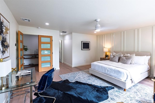 11224 Pickard Ln, Austin, TX 78748 - bedroom with wood finished floors, recessed lighting, a decorative wall, and ceiling fan