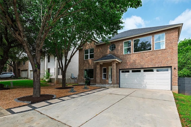 11224 Pickard Ln, Austin, TX 78748 - view of front of house with an attached garage, concrete driveway, and brick siding