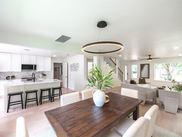 11224 Pickard Ln, Austin, TX 78748 - dining space with stairway, ceiling fan, recessed lighting, and light wood finished floors