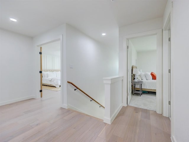11224 Pickard Ln, Austin, TX 78748 - corridor featuring an upstairs landing, light wood-style flooring, and recessed lighting