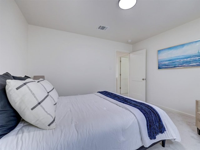 bedroom with carpet floors, baseboards, and visible vents