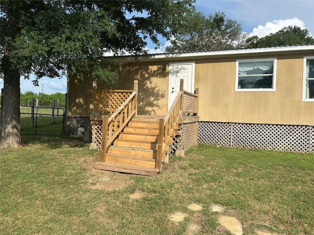 view of front of property with fence and a front lawn