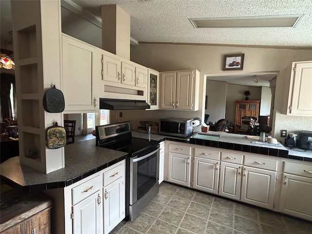 kitchen featuring ornamental molding, tile counters, and stainless steel appliances