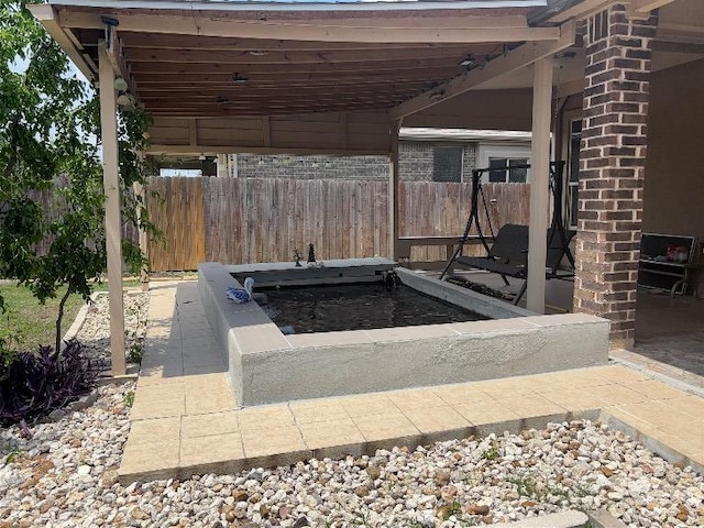 view of patio with fence