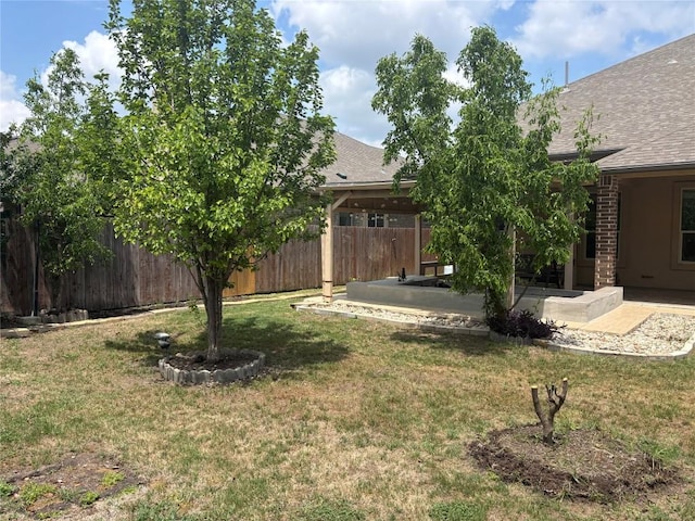 view of yard featuring a patio and fence