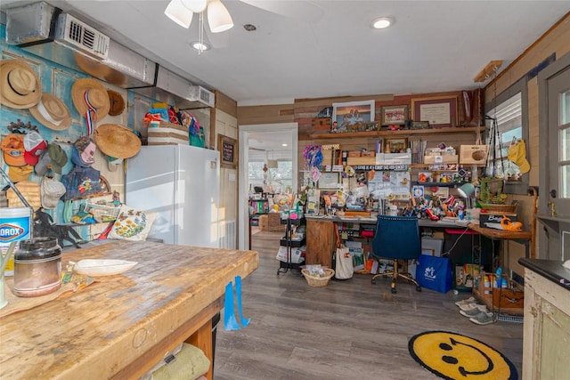 dining room with ceiling fan, wood finished floors, and visible vents