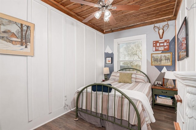 bedroom with ceiling fan, wood ceiling, and wood finished floors